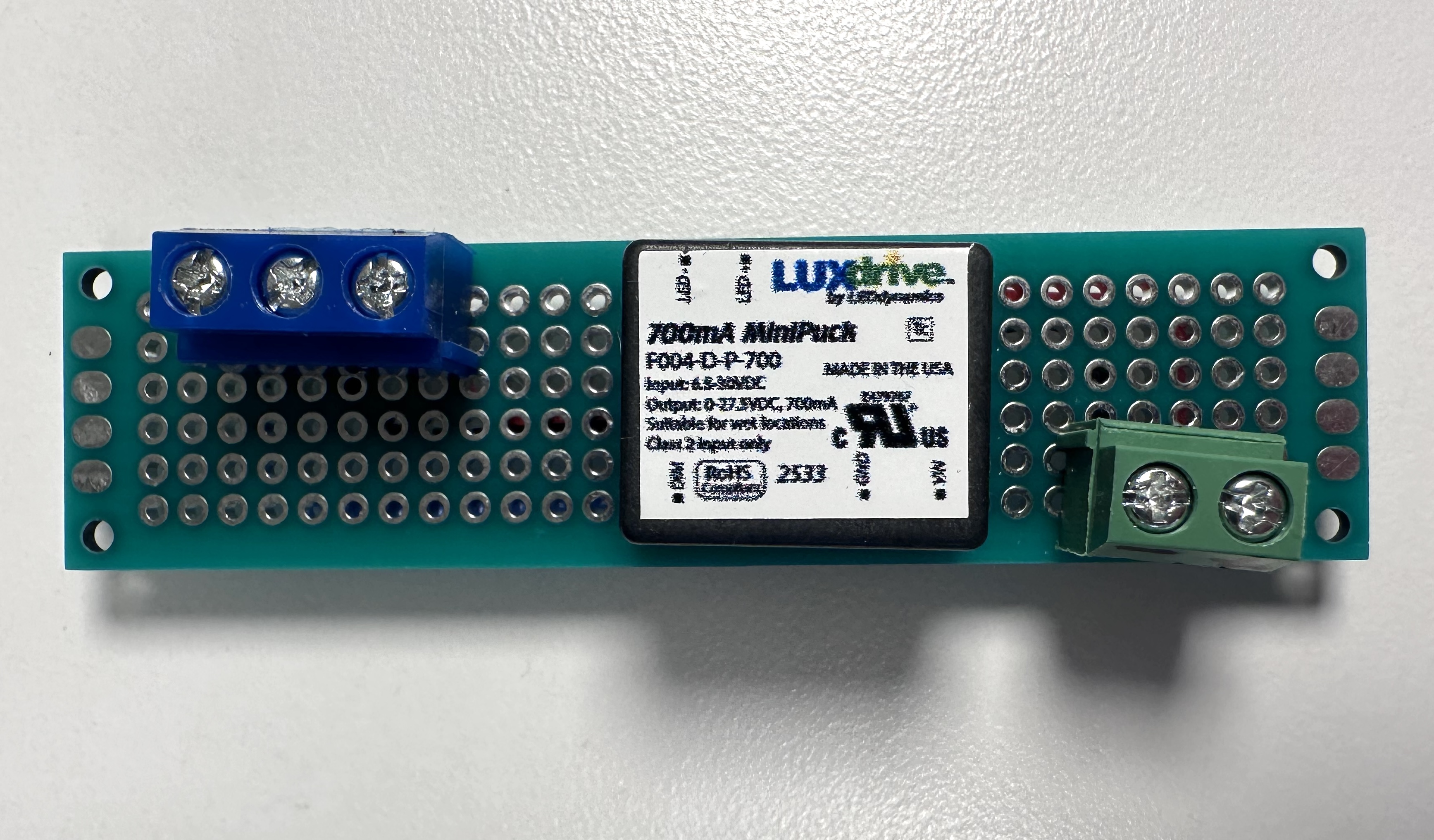 Photo of a MiniPuck LED Driver mounted to a PCB board