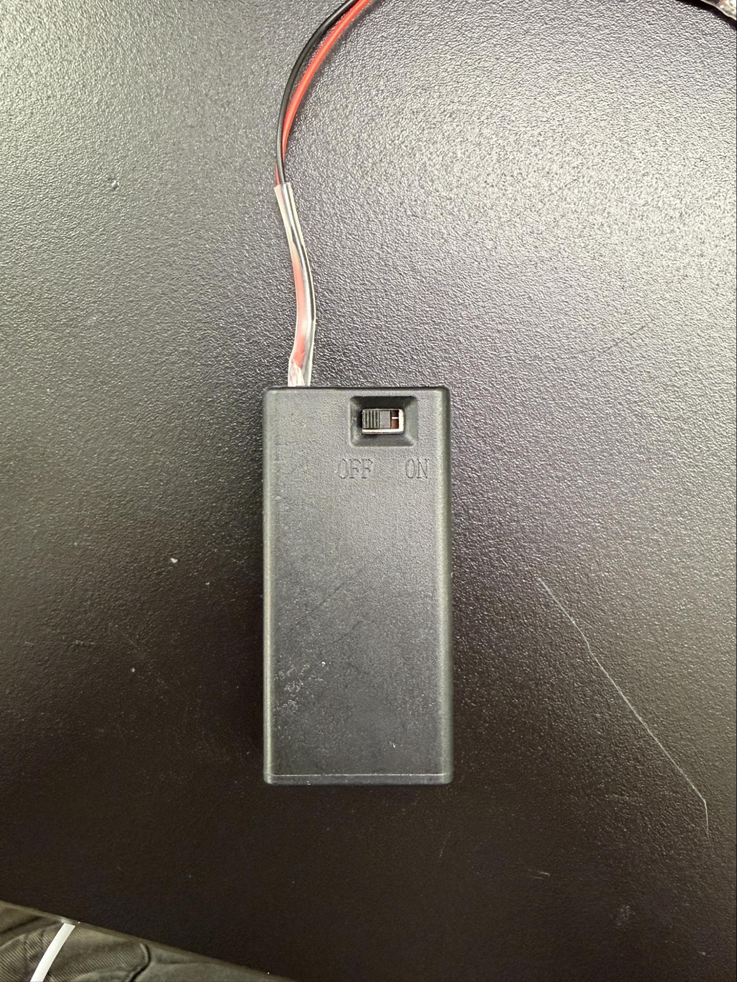 photo of a 9V battery case with switch